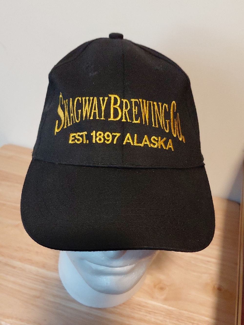 Covington Black Baseball Cap with Gold Embroidered 'Skagway Brewing Co'